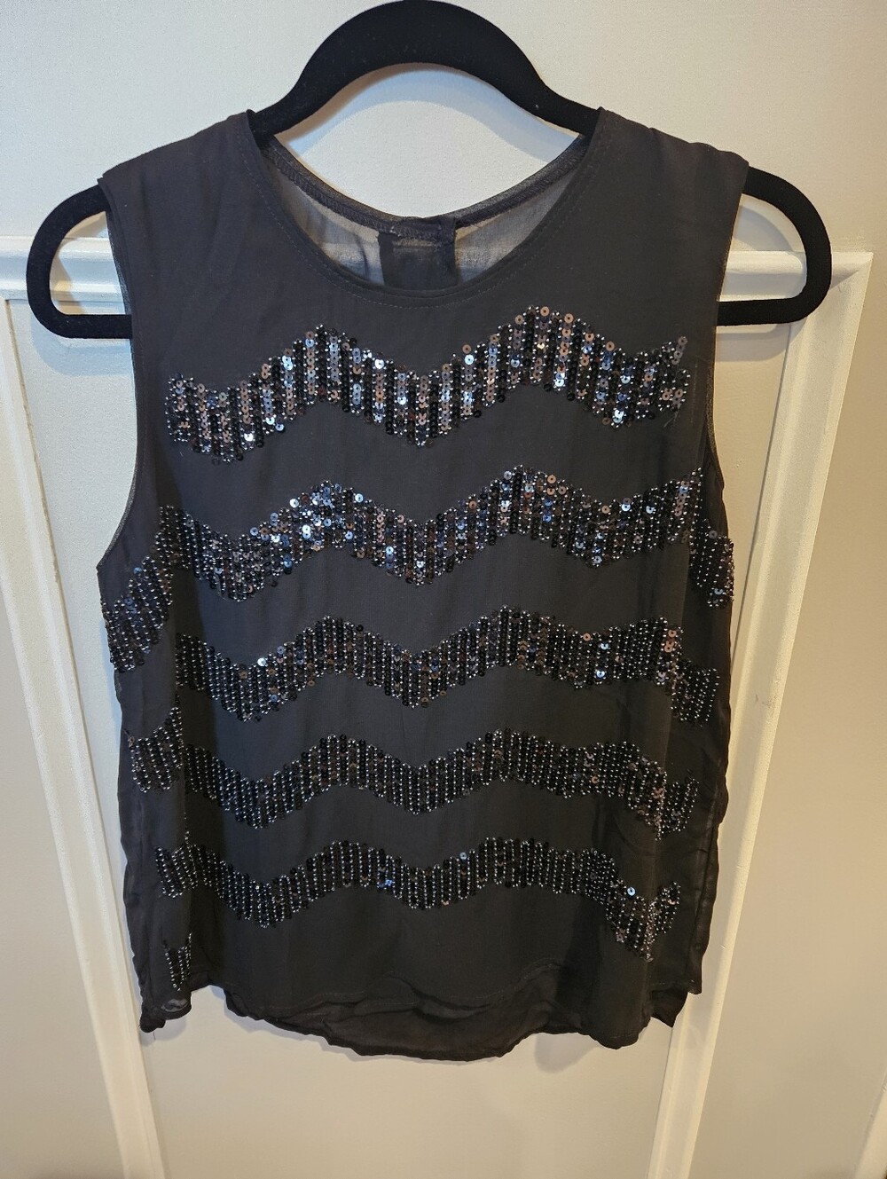 Black sheer sequined & black beaded top. Size medium.